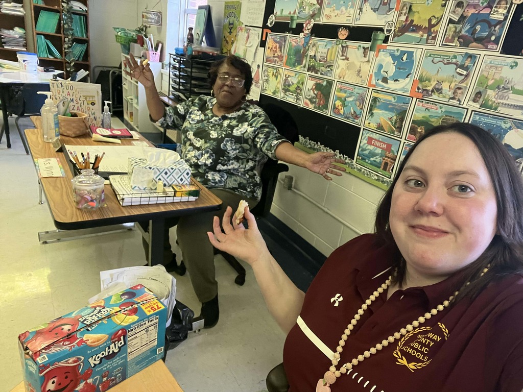 Teachers enjoying their pizza party.
