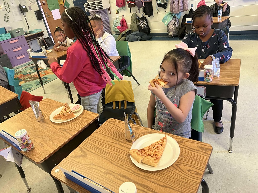 Students enjoying their pizza party.