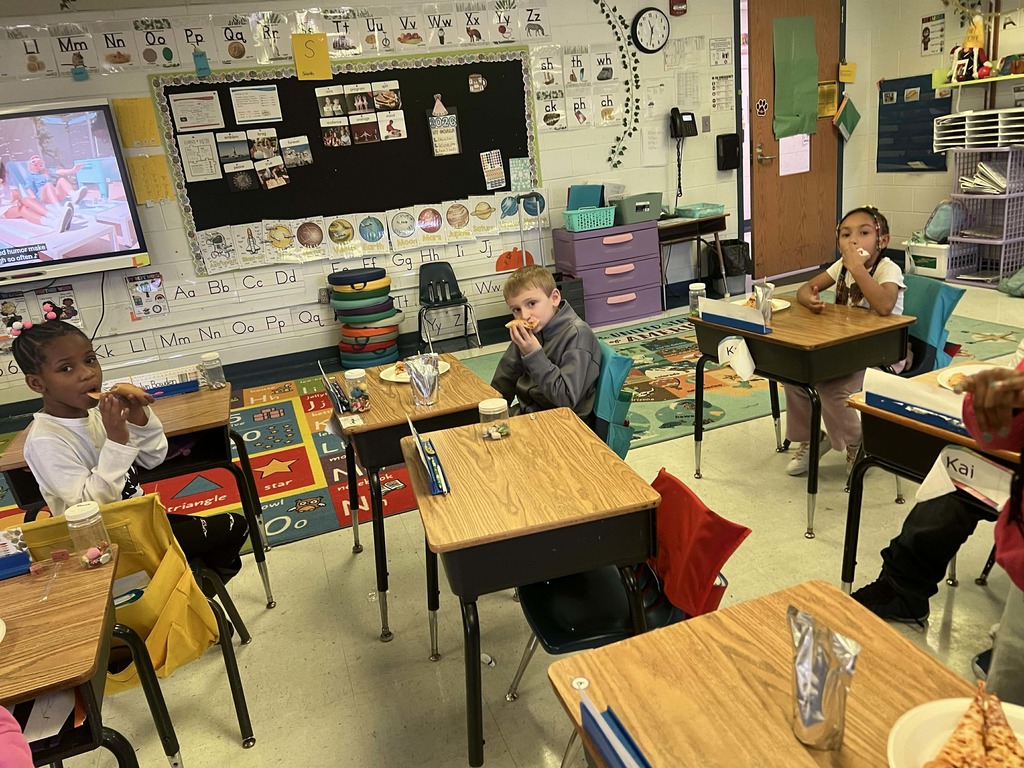 Students enjoying their pizza party.