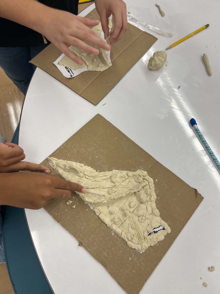 Fourth Grader making a raised-relief map