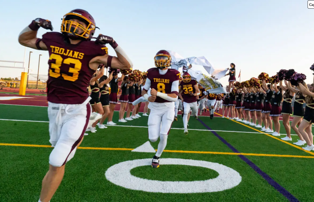 Trojan Football players take the field