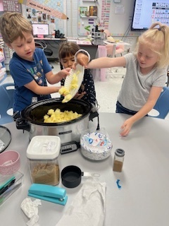 Adding the apples to the crockpot!
