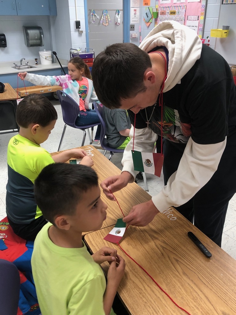 Spanish II students helping second graders.