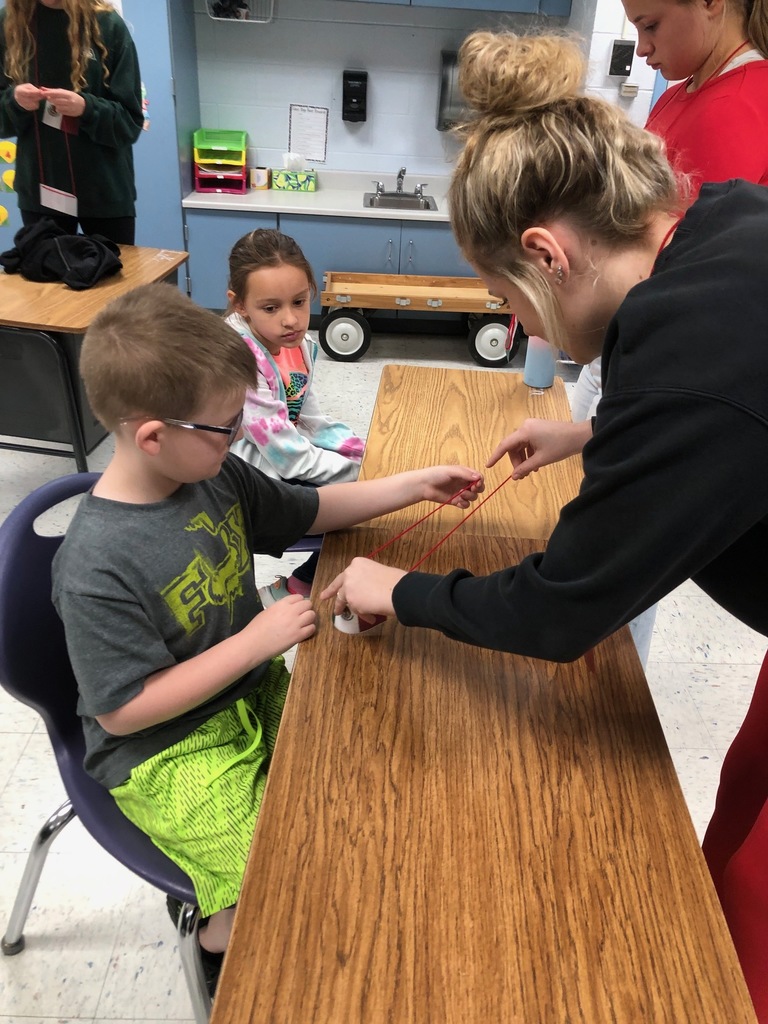 Spanish II students helping second graders.