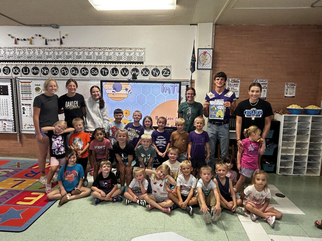 FFA officers teaching kindergarteners about bees and pollinators.