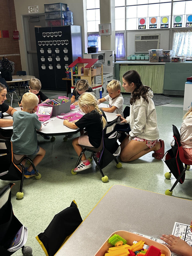 FFA officers teaching kindergarteners about bees and pollinators.