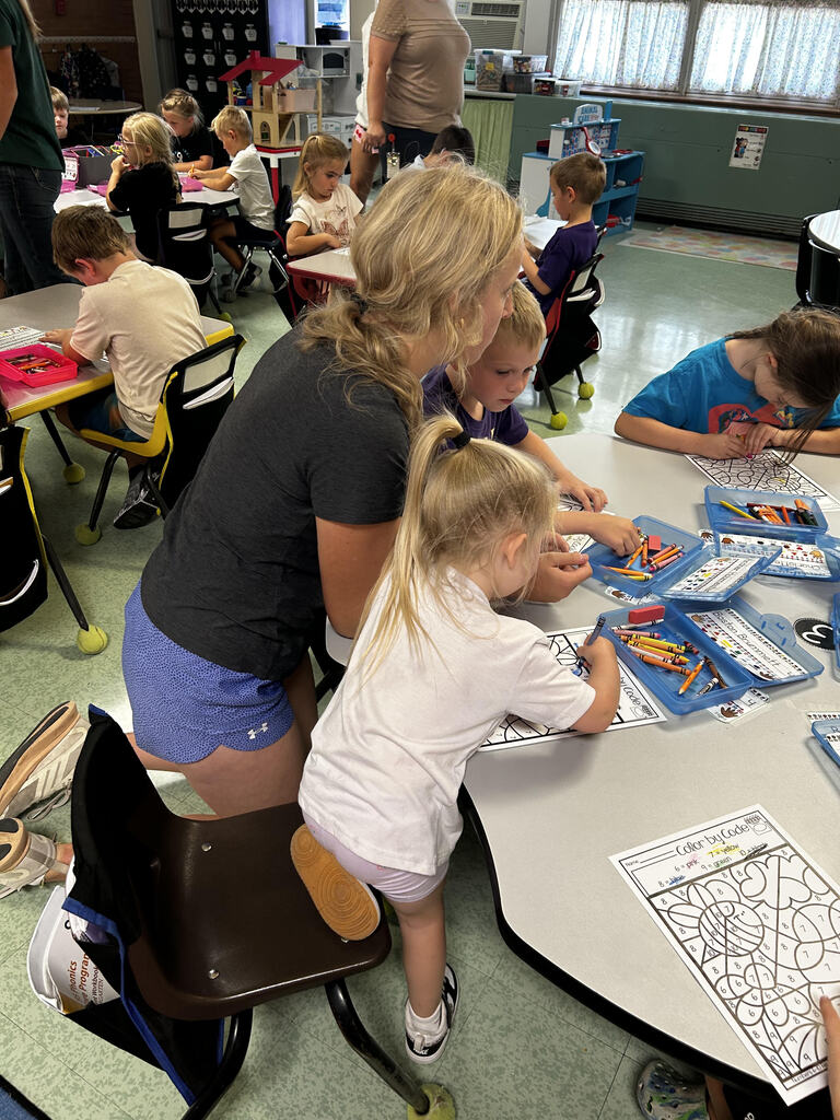 FFA officers teaching kindergarteners about bees and pollinators.