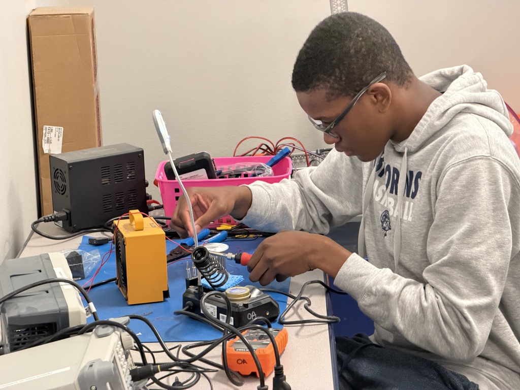kid doing electrical work