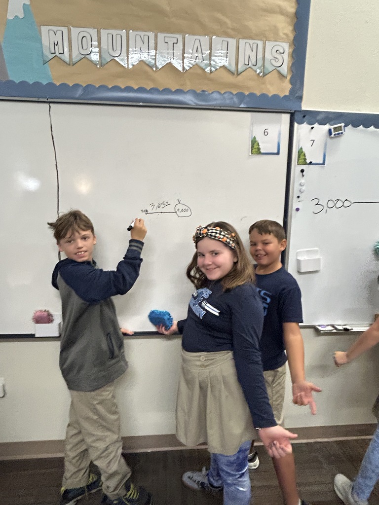 Kids smiling doing math