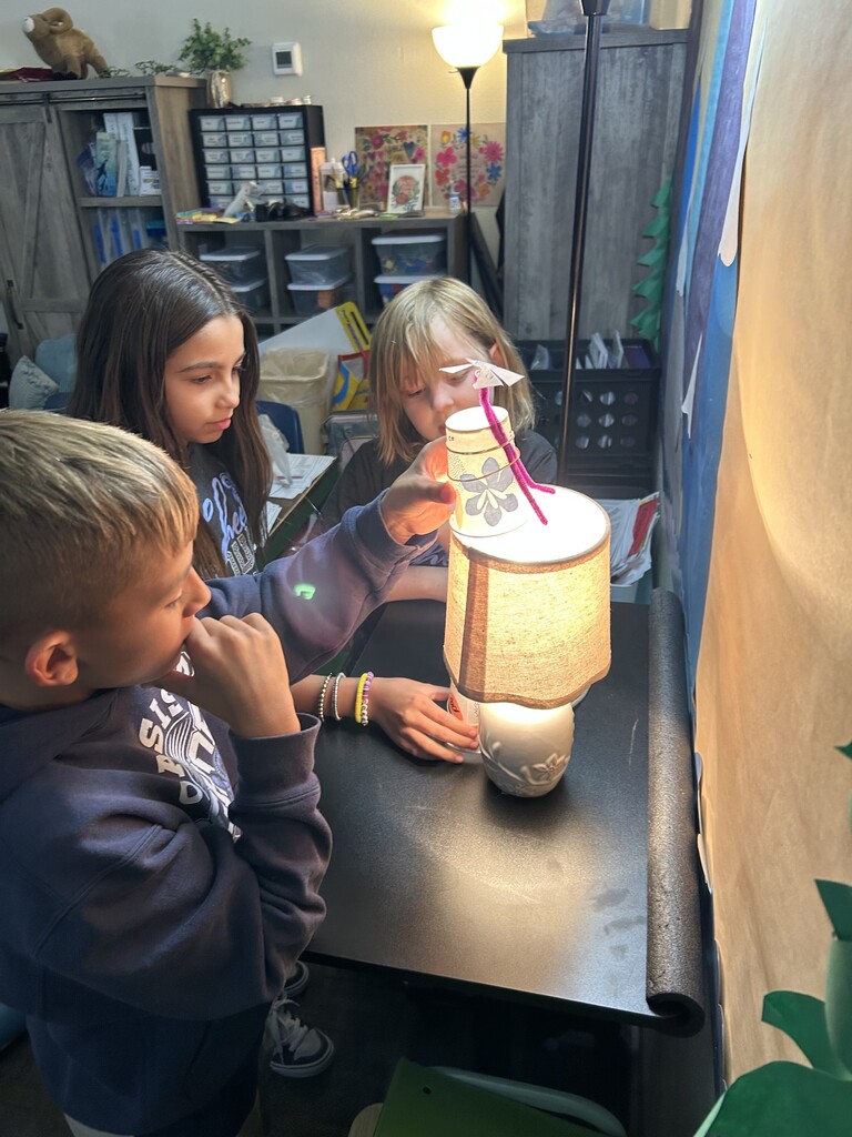Fourth Graders Doing Heat Experiment