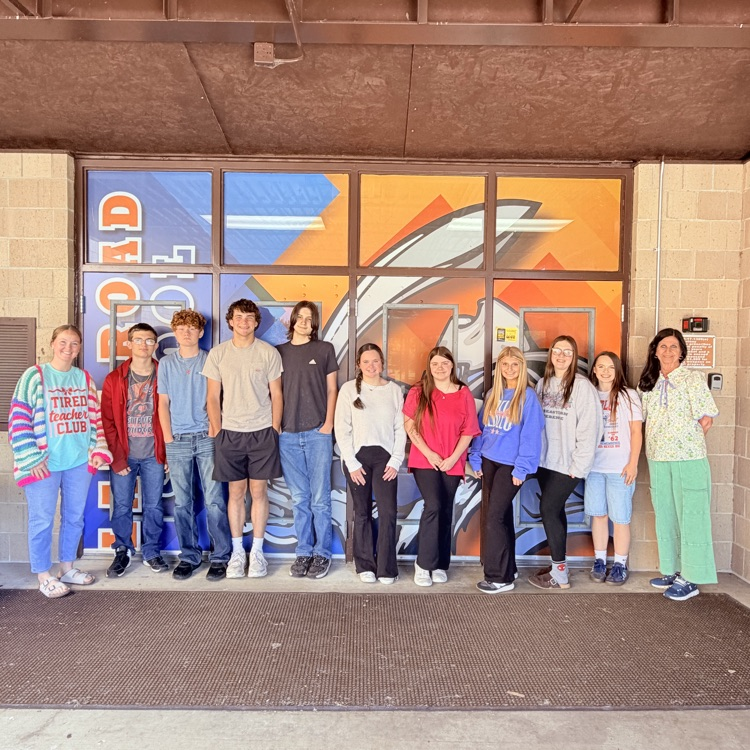 group of LRS students standing outside out the school for a picture