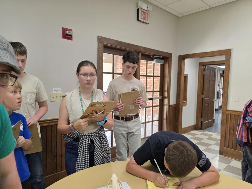 3 students participating in the wildlife ID contest.