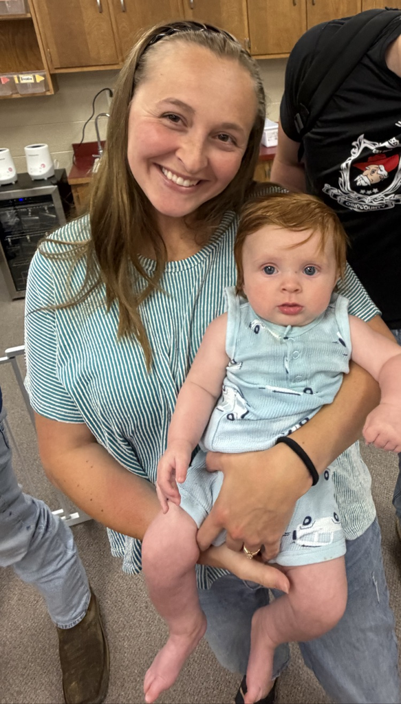 A mother and her son looking at the camera