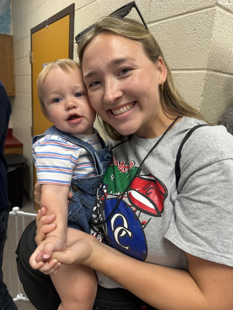 A mother and her young son smiling