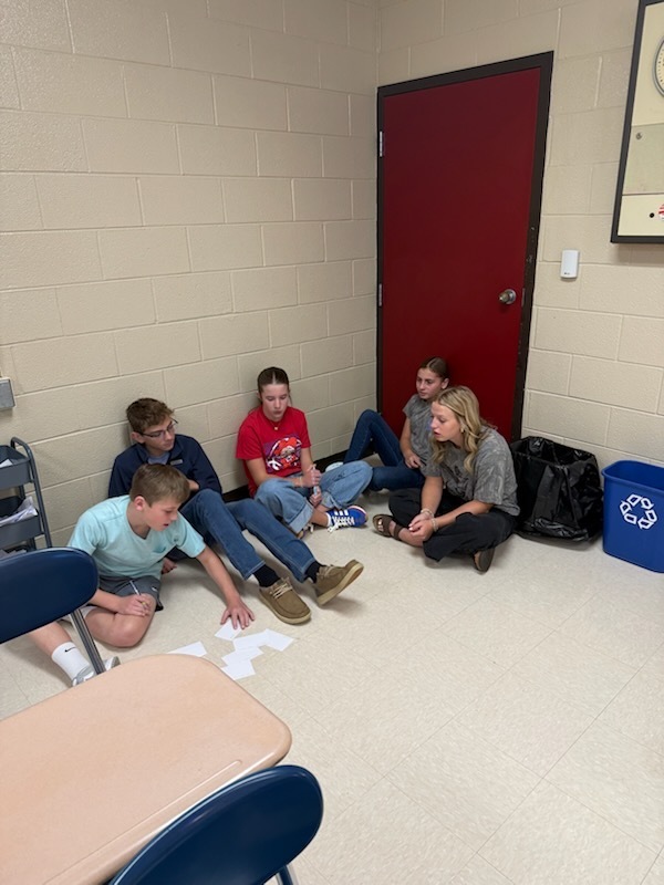 Photo of students participating in group project.