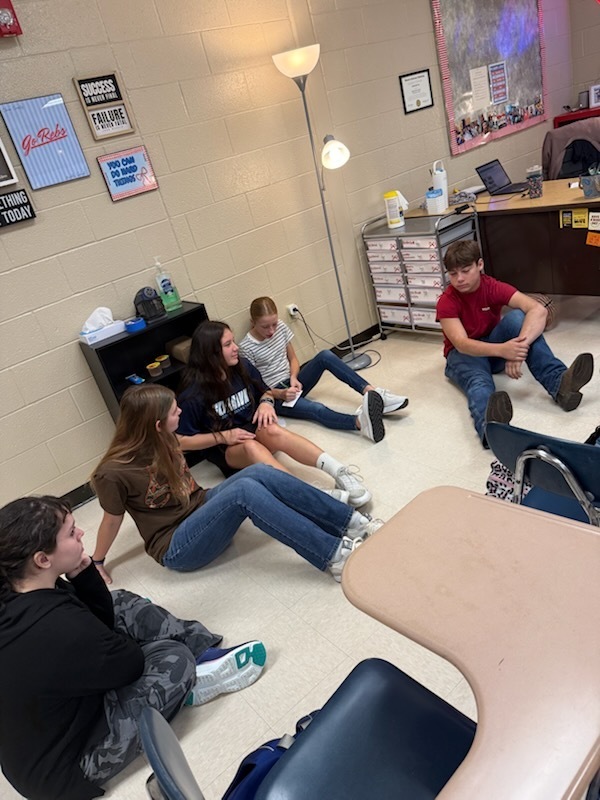 Photo of students participating in group project.