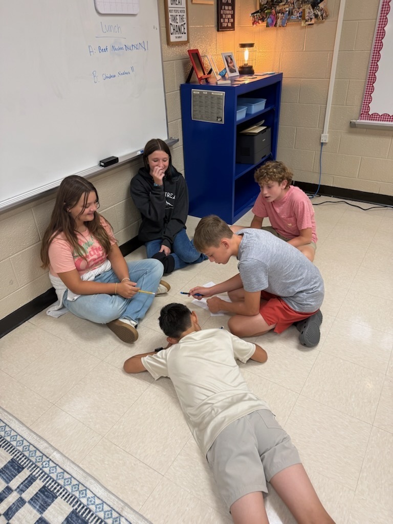 Photo of students participating in group project.
