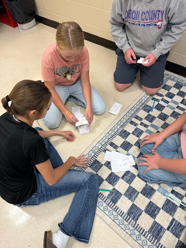 Photos of students participating in group project.