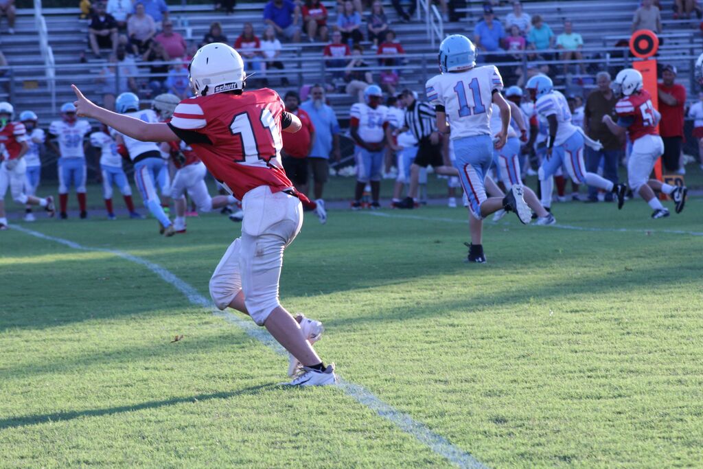 South Fulton Middle School football player runs on the field during a football game.