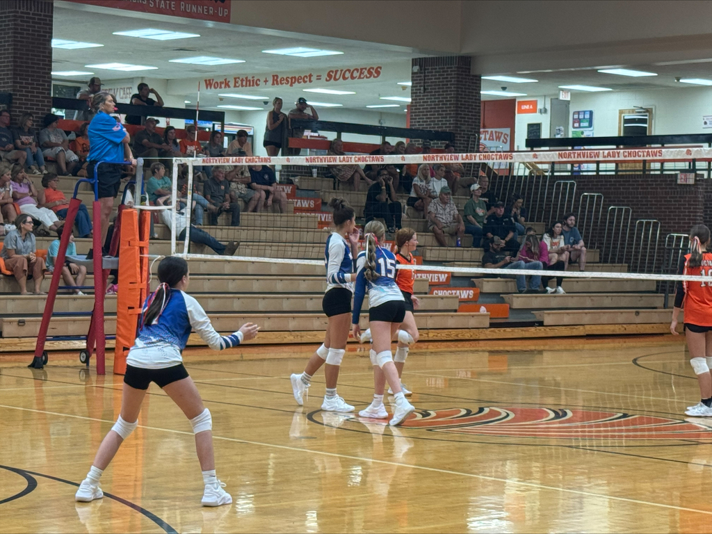 Obion County Middle School volleyball players are ready to begin play during a recent volleyball game.