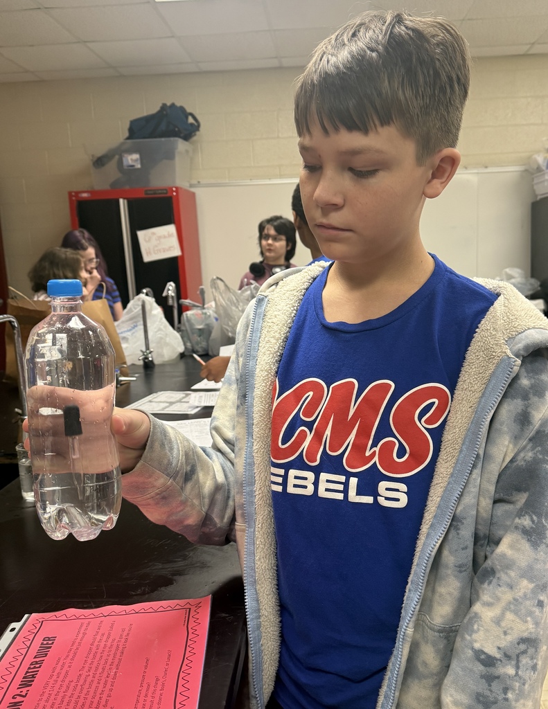 Students in Ms. Demanda’s 7th-grade science class participate in several hands-on experiments exploring states of matter and gas laws. Photos show students working together at lab stations with bottles, balloons, glassware, water, heat, and other classroom science materials while recording and observing their results.