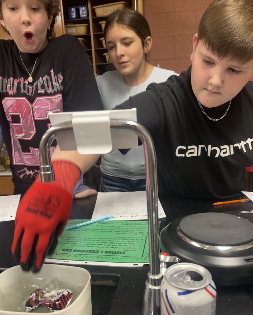 Students in Ms. Demanda’s 7th-grade science class participate in several hands-on experiments exploring states of matter and gas laws. Photos show students working together at lab stations with bottles, balloons, glassware, water, heat, and other classroom science materials while recording and observing their results.