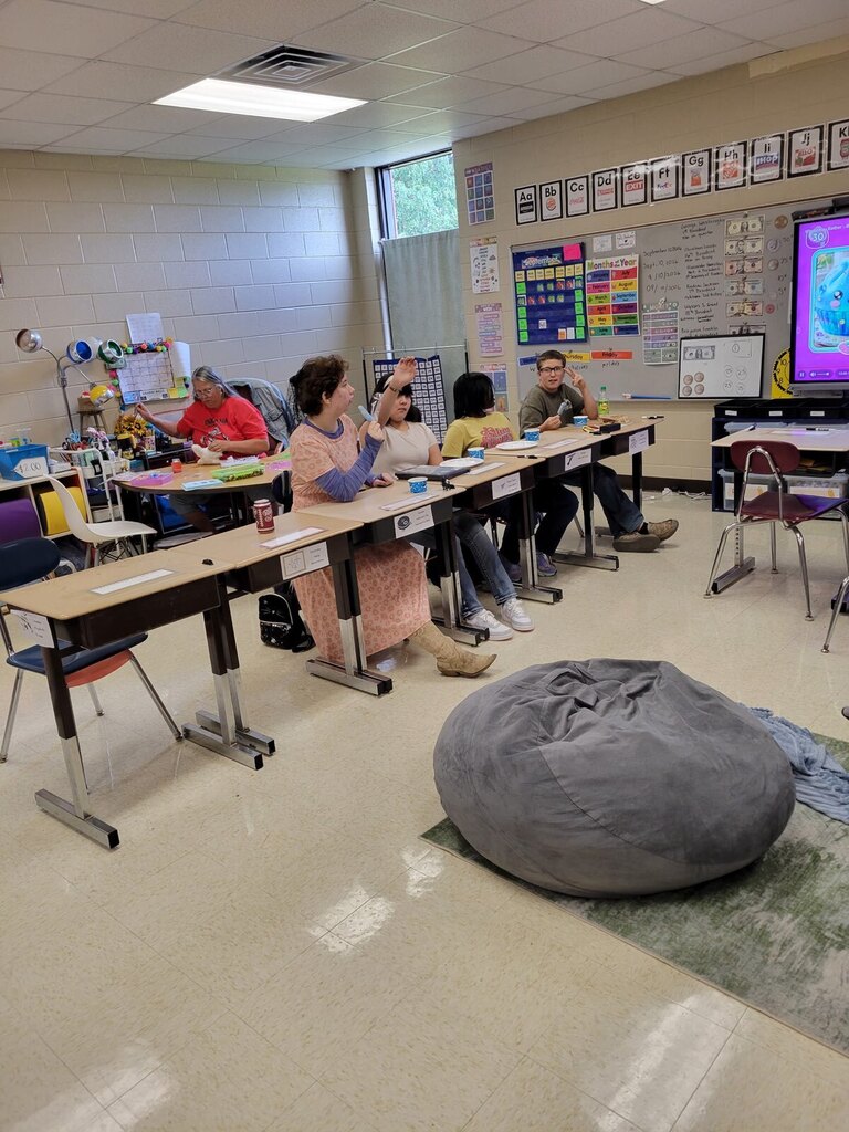 Students in the OCMS ACHIEVE class celebrate Fun Friday after completing their work and showing academic improvement. Photos show students and staff participating in classroom activities and enjoying treats together.