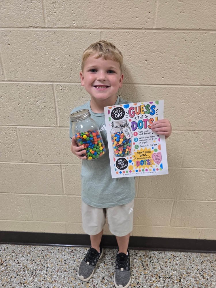 student holding a jar of mms. he guessed the closet number in the jar 