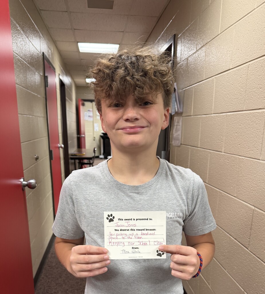 student holding card 