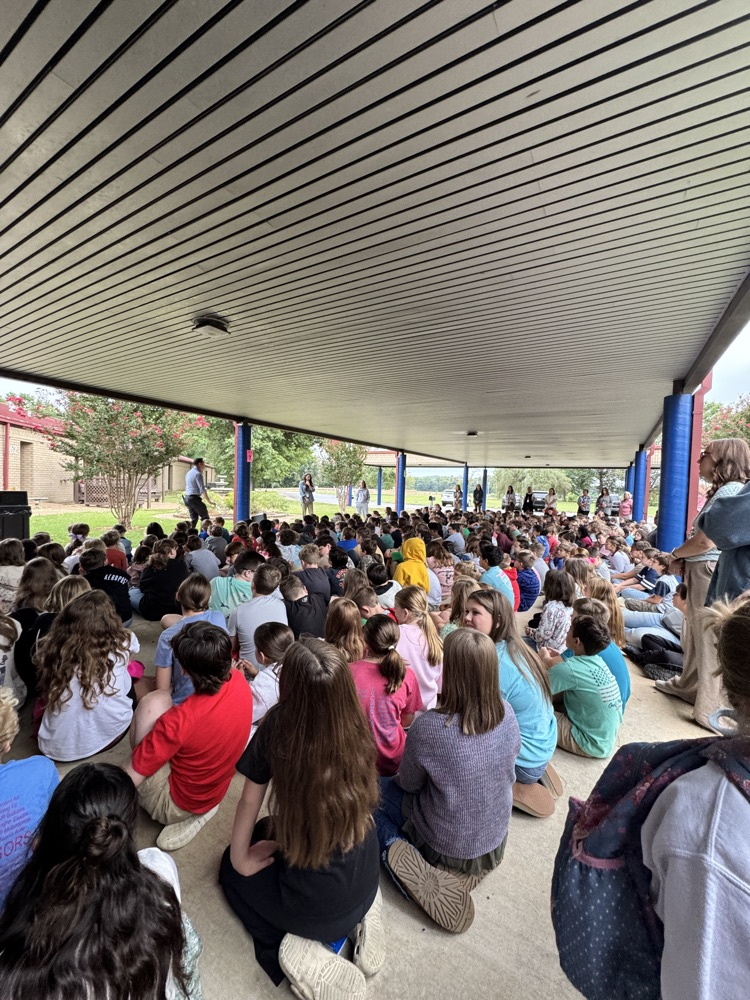 students sitting in a crowd 