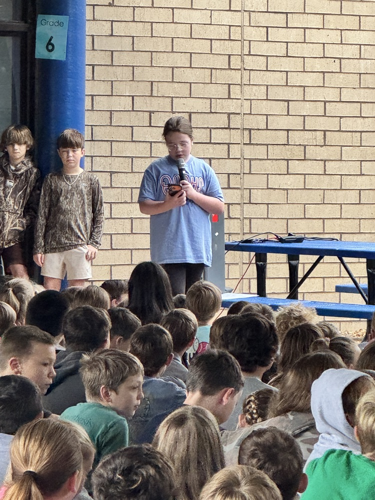 student leading prayer 