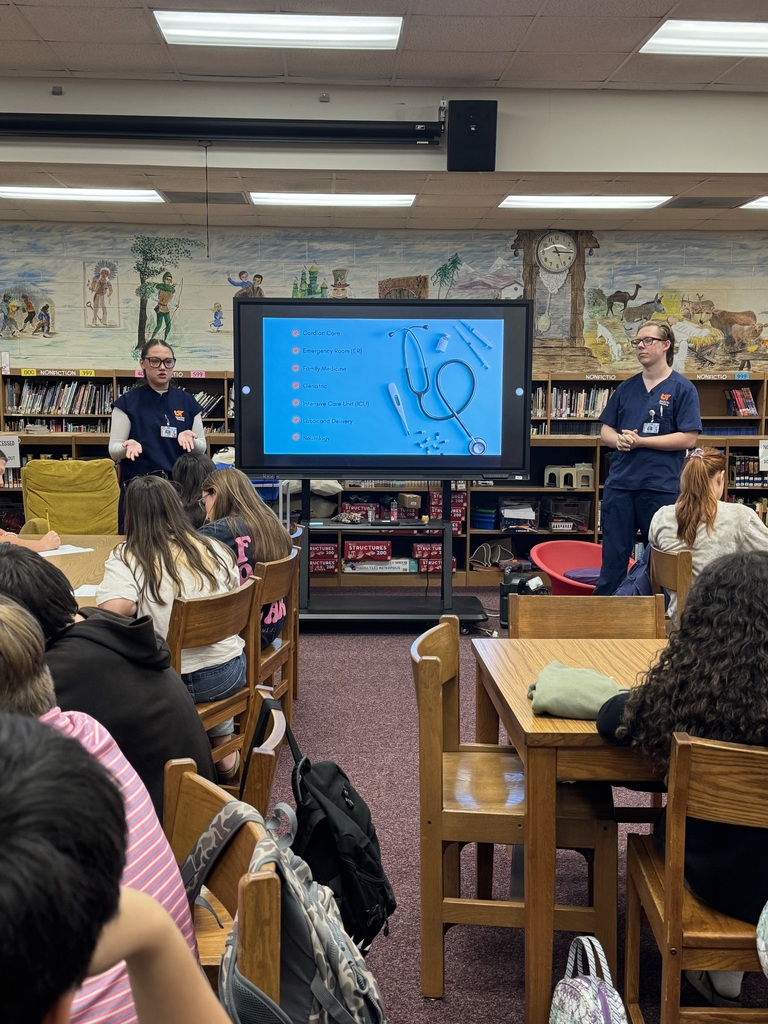 Two UTM nursing students present information about different areas of nursing to OCMS students.