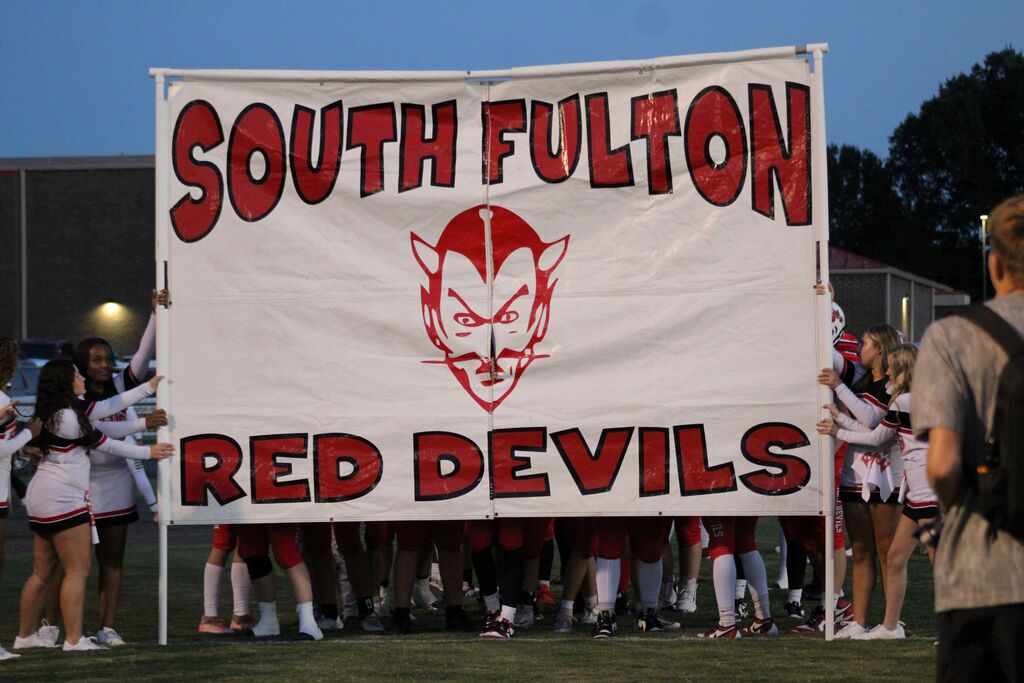 South Fulton Red Devils spirit sign, held by cheerleaders.