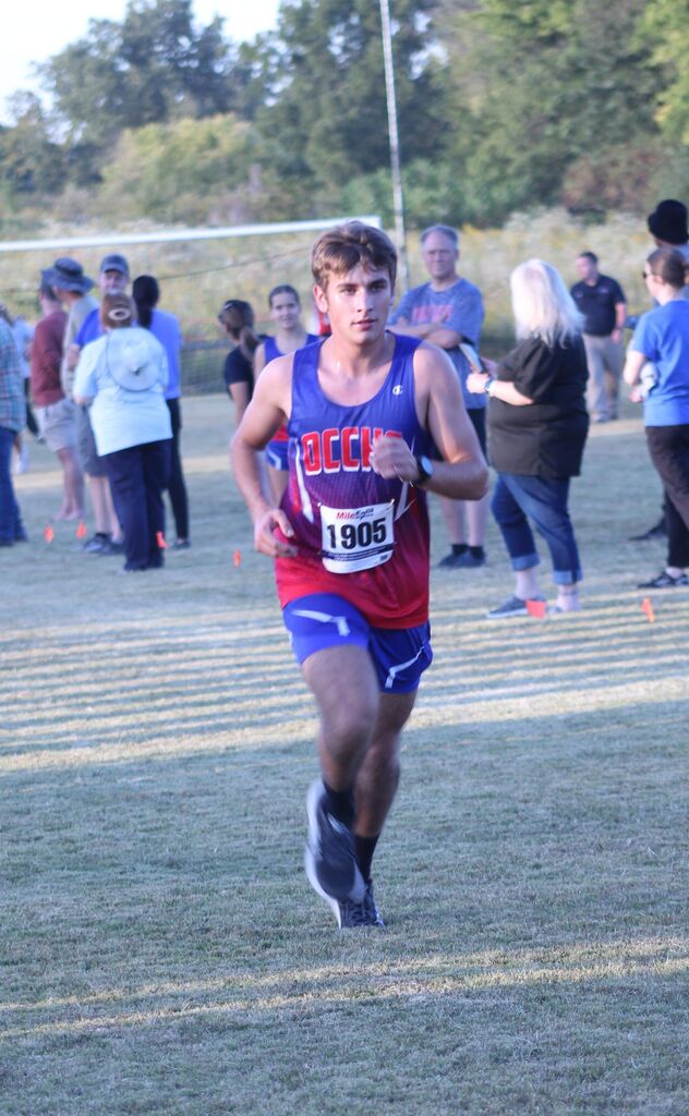 OCCHS Boys' Cross-Country runner completing the race.