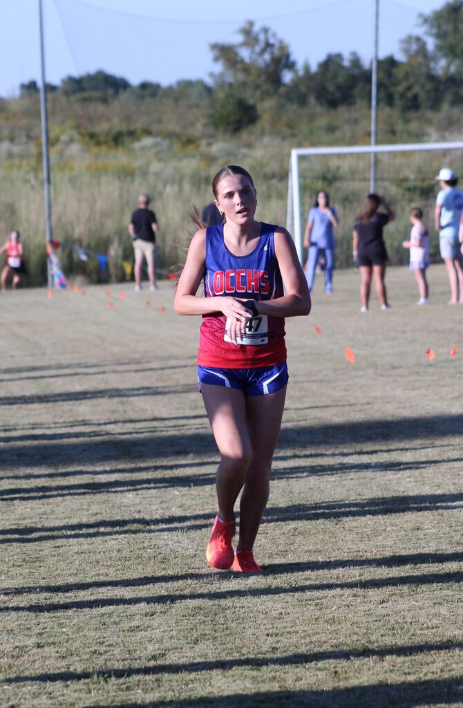 OCCHS Girls' Cross-Country runner completing the race.
