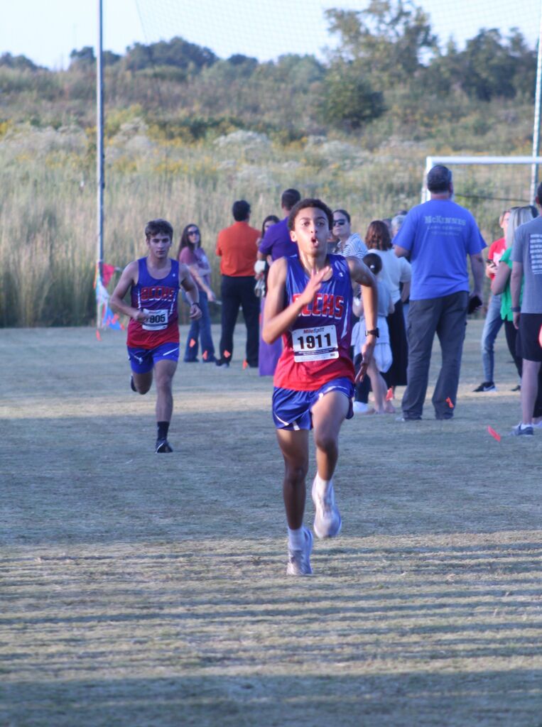 OCCHS Boys' Cross-Country runner completing the race.