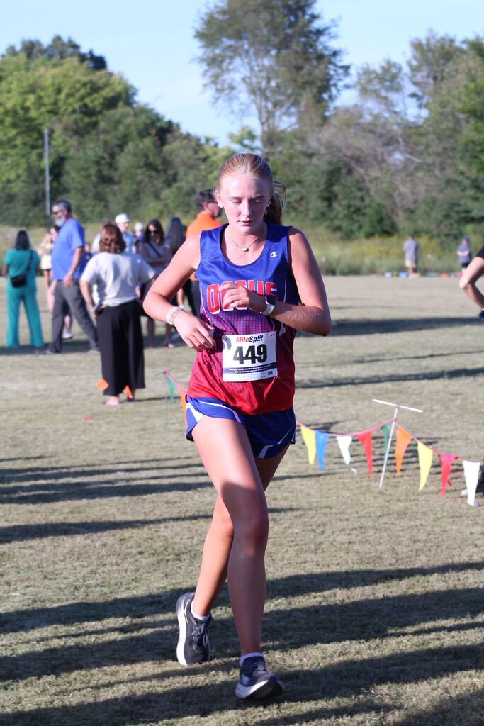 OCCHS Girls' Cross-Country runner completing the race.