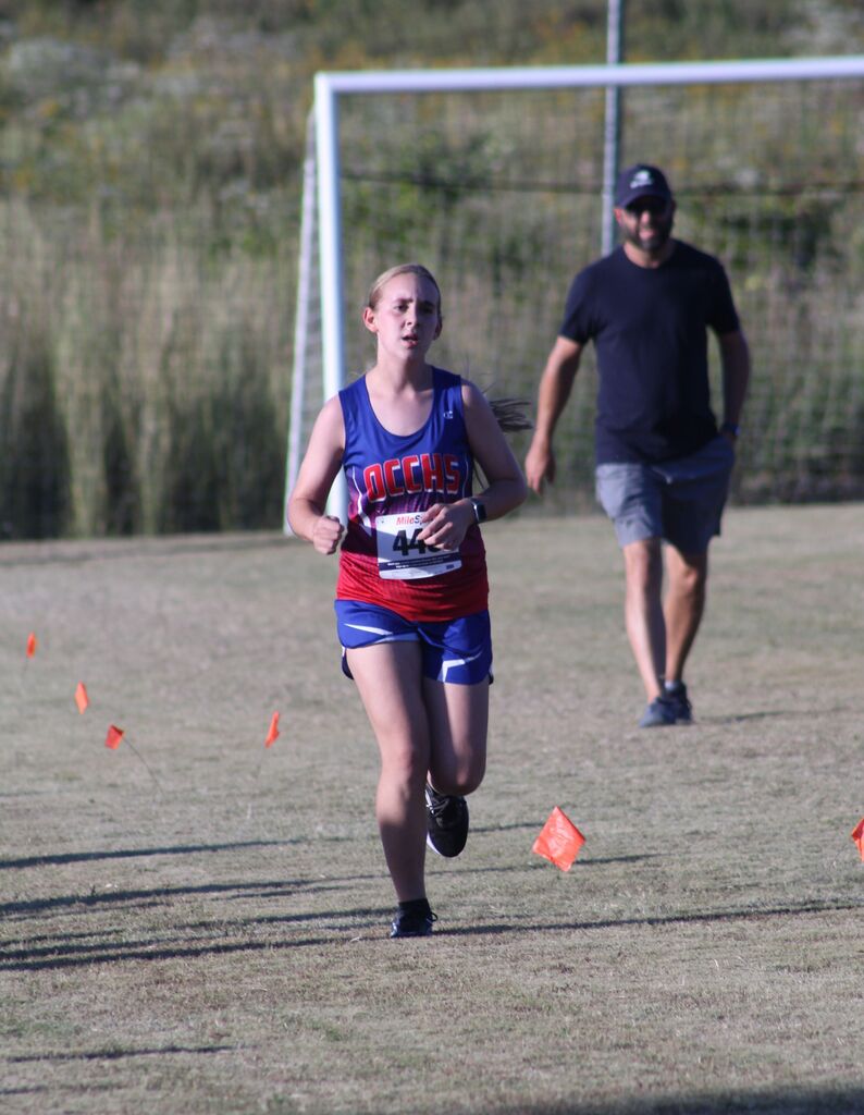 OCCHS Girls' Cross-Country runner completing the race.