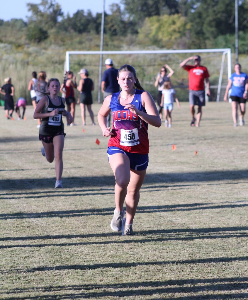 OCCHS Girls' Cross-Country runner completing the race.