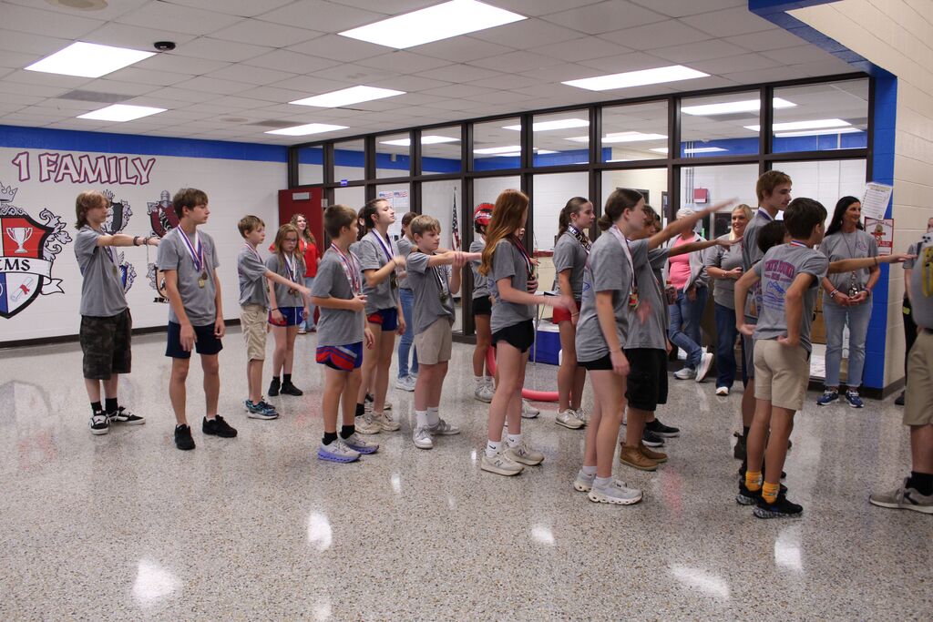 The OCMS Cross Country team lines up to run the halls before leaving for State.
