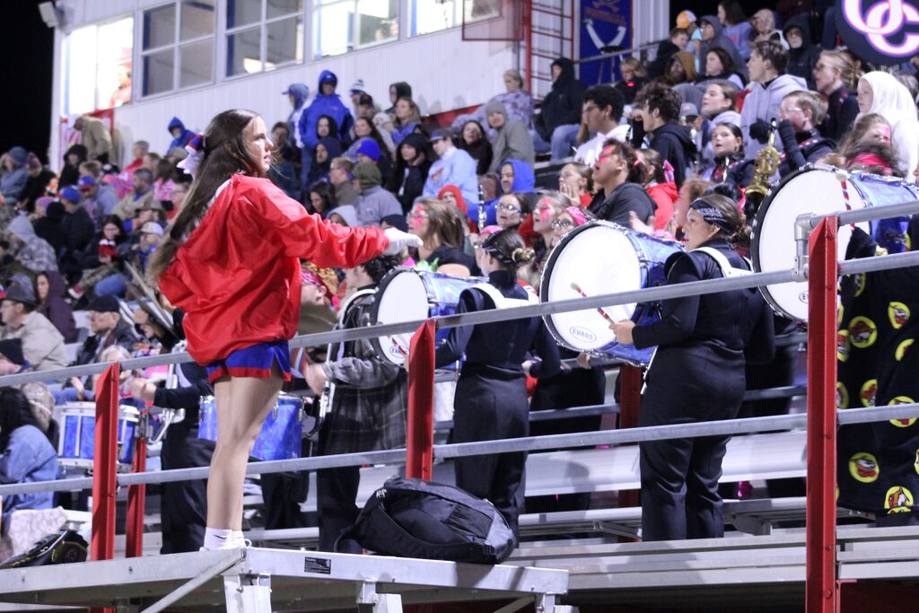 OCCHS band plays during the football game while being led by the field commander.