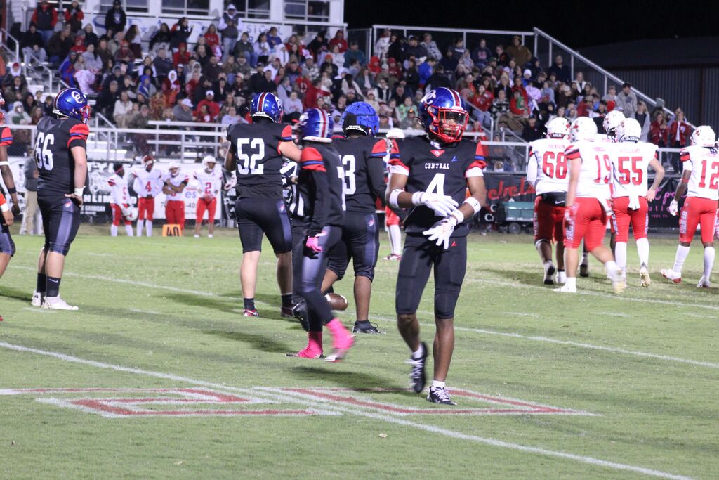 OCCHS and SFHS players on the field between plays during the football homecoming game.