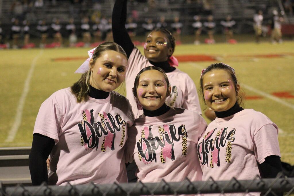 A group of South Fulton High School cheerleaders smile together for the camera.