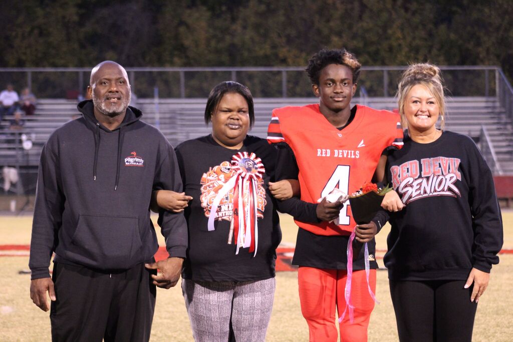A South Fulton football player and family smile for the camera.