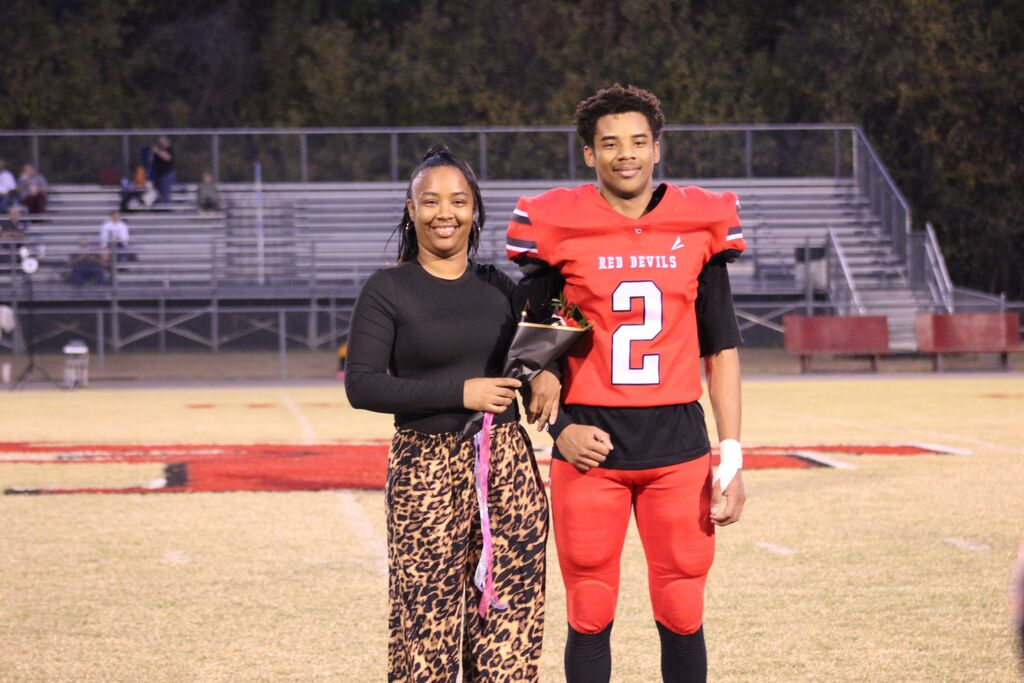 A South Fulton football player and family smile for the camera.