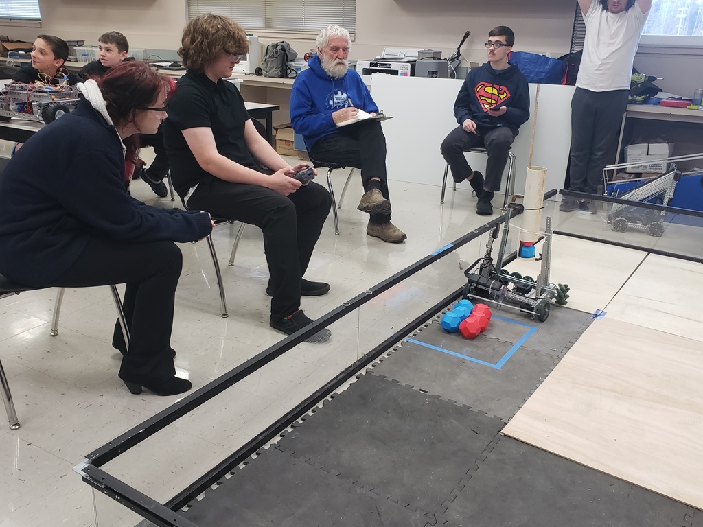 Sterling Lake and Serenity Gisby competing with their robot.