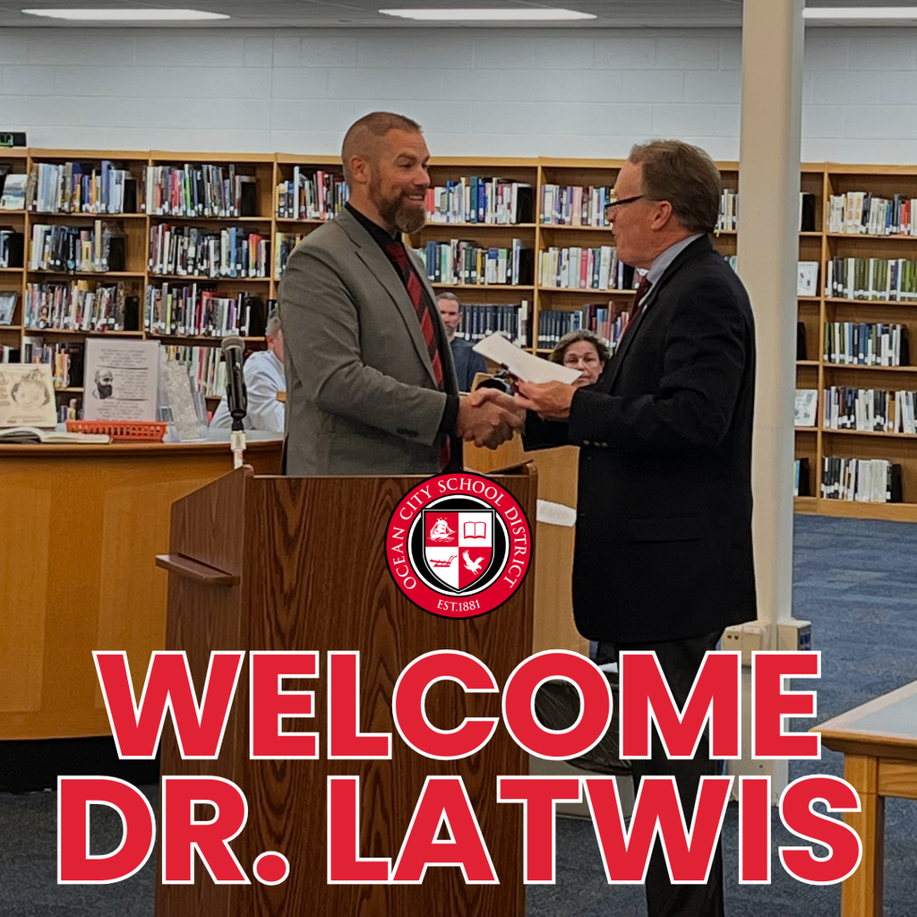 Mr. Kevin Barnes congrats new Superintendent of Schools, Dr. Brian Latwis. 