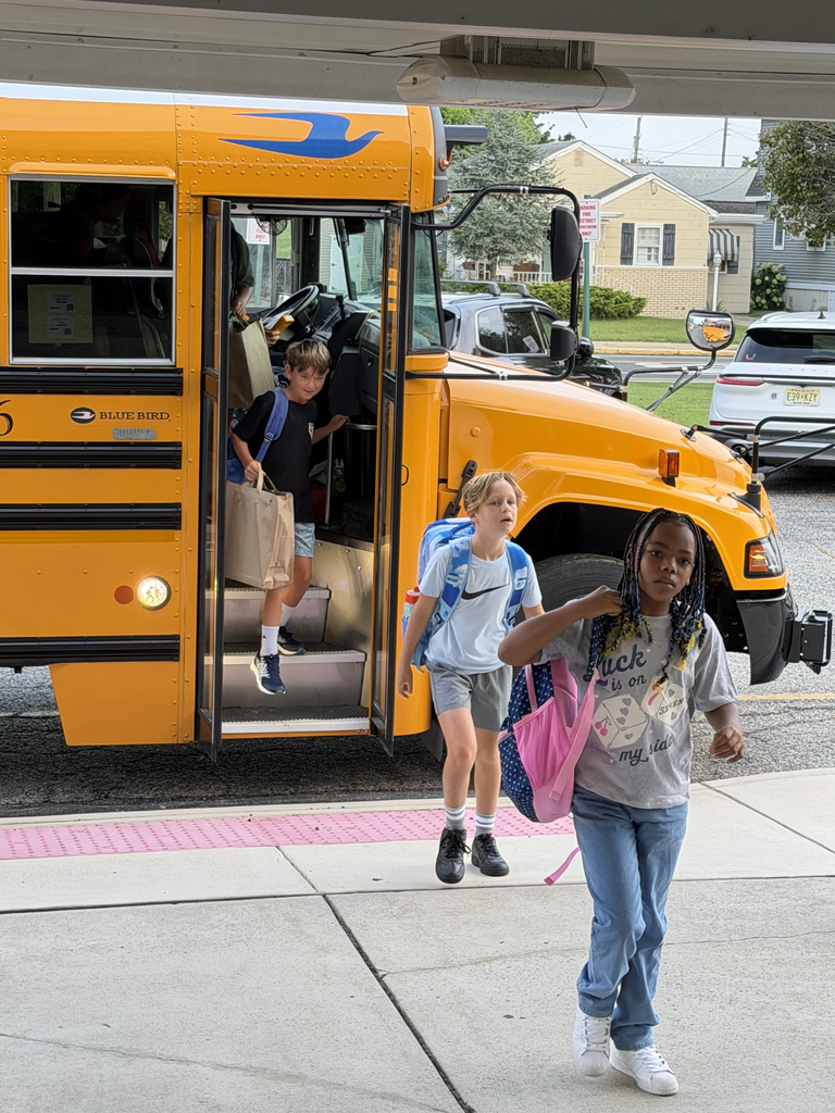 students walking off the bus