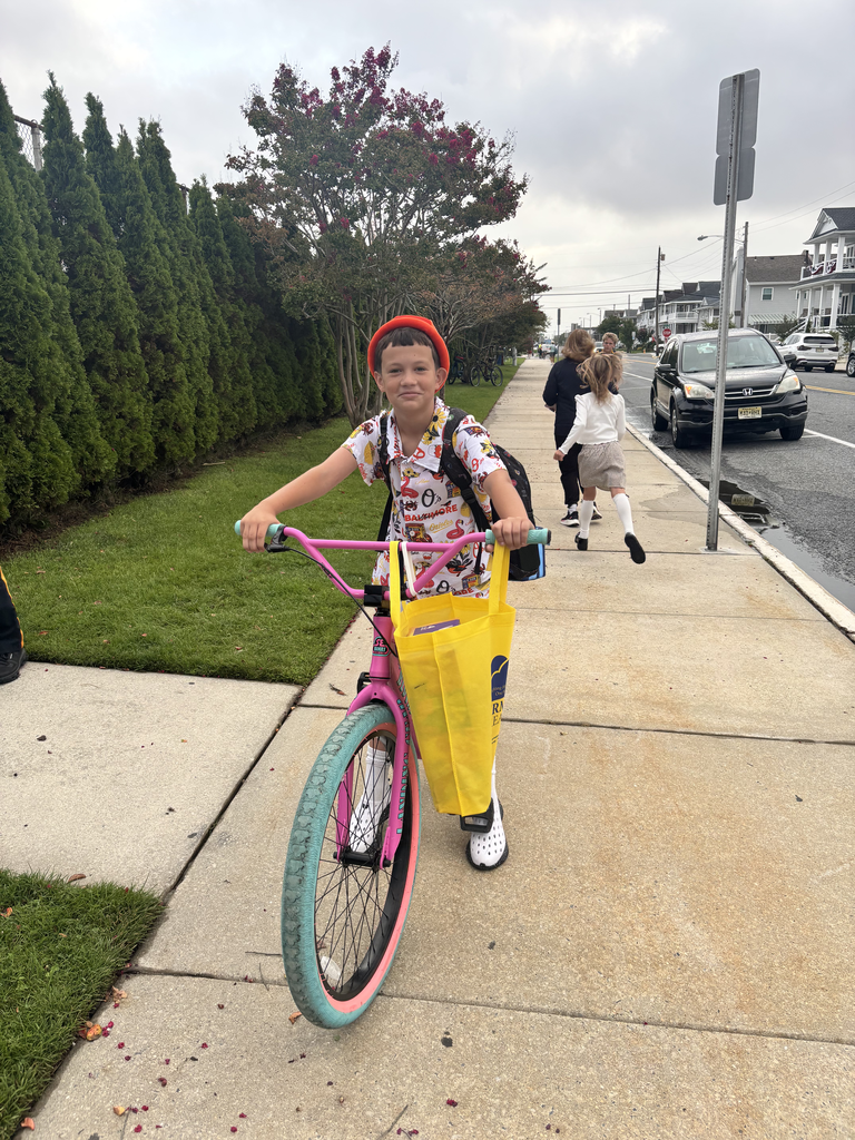 student walking on bike