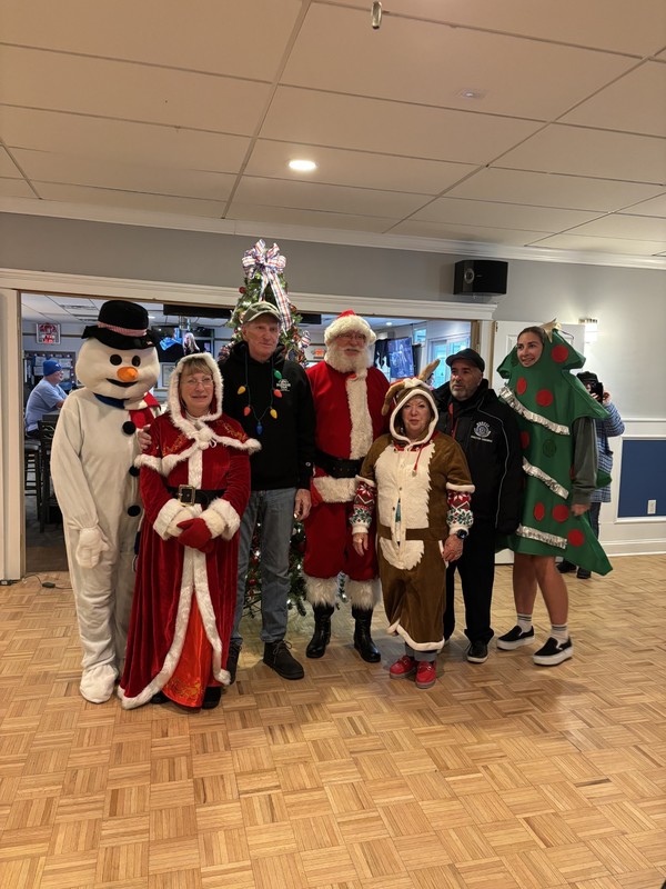 Members of VFW Auxiliary to Post 1963 get in the holiday spirit as they deliver cards made by Ocean City High School students to the Vineland Memorial Veterans Home.